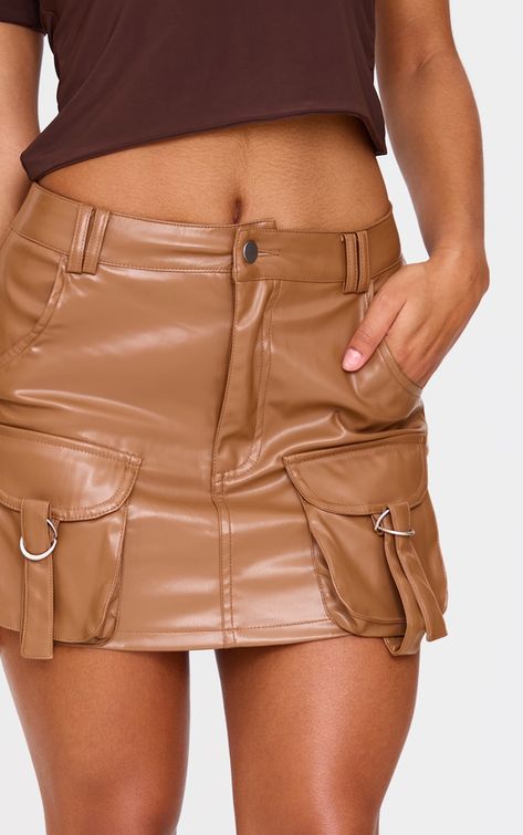 This brown faux leather pocket detail cargo mini skirt is a must have option for whatever your weekend plans. With its seasonal brown shade, faux leather material and pocket detail, how can you not love? The cargo style is a staple, so style with a slinky brown top and neutral court heels for a chic look. It's a yes from us. Length approx 33cm/13inch (Based on a sample size UK 8) Model wears size UK 8/ EU 36/ AUS 8/ US 4Model Height - 5ft 6inchp]:!mb-0inch>Category: BottomsProduct type: Mini SkirtColour: BrownMaterial: Faux LeatherDesign: PlainOccasion: Evening Layering Hoodies, Cargo Mini Skirt, Wide Fit Sandals, Brown Shade, Court Heels, Leather Pocket, Cargo Style, Weekend Plans, Brown Shades