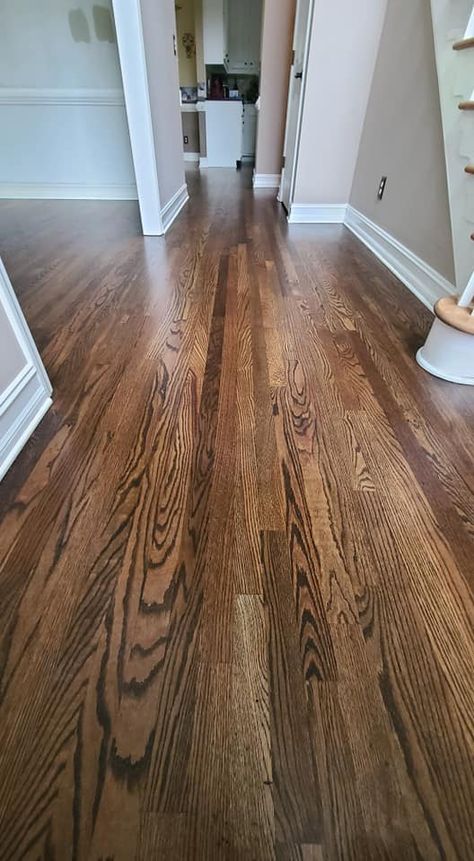 Here is a 2 1/4 Red Oak floor with a Dark Walnut Stain and 3 coats of water base finish! We serve all of NE Ga from Atlanta to Athens, from Lake Hartwell to Lake Oconee. Call to schedule a free estimate today at 770 554 1555! Cherry Oak Hardwood Floors, Dark Stains For Wood, Stain Colors For Wood Floors, Oak Hardwood Floors Colors Wood Stain, Dark Walnut Floor Stain, Dark Oak Hardwood Floors, Dark Walnut Hardwood Floors, Wooden Floor Stain Colors, Red Oak Hardwood Floors Kitchen