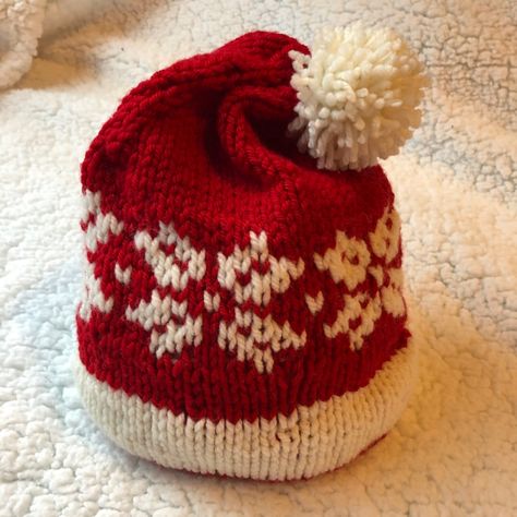 This Santa Hat knitting pattern incorporates the snowflake chart from another hat pattern in my library called "Henry's Hat & Cowl Pattern" on ravelry.  This Santa hat has a double knit brim and then the layers are separated and the inner layer and outer layer are knit separately to provide extra warmth. Santa Hat Knitting Pattern, Knitting Projects Hats, Baby Mittens Knitting Pattern, Baby Mittens Knitting, Baby Hats Knitting Free, Knitted Heart Pattern, Christmas Knitting Projects, Baby Hat Knitting Pattern, Loom Knitting Projects