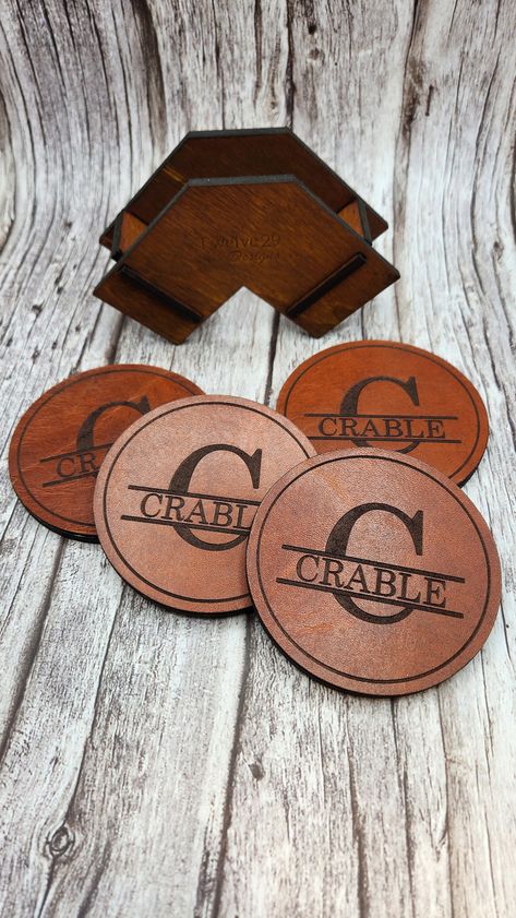 Handcrafted leather and wood coaster set. Custom Laser engraved with your choice of name and large initial. Includes the same custom engraved design on the wooden coaster holder. Made from the highest quality Horween leather, sourced from one of the oldest tanneries in America. This premium leather is made to last and wear into a beautiful patina over time. This complete custom set makes a fantastic gift for any occasion. Engraved Coasters, Coaster Holder, Leather Coasters, Horween Leather, Wooden Coasters, Wood Coasters, Handcrafted Leather, Memorial Gifts, Fantastic Gifts