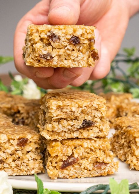 Discover our irresistible Fruit Flapjack recipe, perfect for a tasty snack or breakfast on-the-go! Packed with oats and your choice of dried fruits, these flapjacks are sure to become a favorite treat. Save this easy-to-follow recipe and indulge in the scrumptious world of fruit flapjacks today! #FruitFlapjacks #DeliciousTreat #BakingFun Fruit And Nut Flapjack Recipe, Fruit Flapjack Recipe, Fruit Slice Recipe, Fruity Flapjacks, Healthy Flapjack, Chocolate Flapjacks, Yogurt Bars, Flapjack Recipe, Fasting Recipes