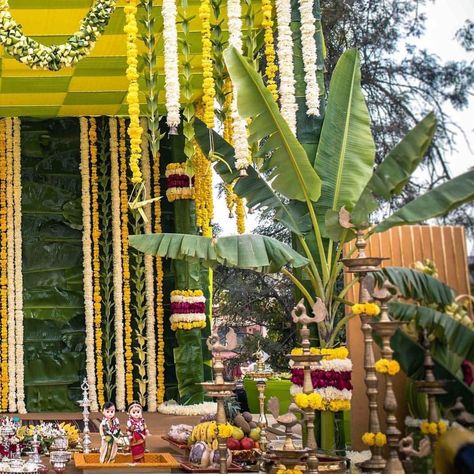 Banana leaves backdrop with flo hangings... #indianweddingblog #saree #designerblouse #teluguwedding #telugubride #tamilwedding #tamilbride #weddingbrigade #gorgeousbride #shopzters #shaadimagic #bridesessentials #ezwed #pellipoolajada #southindianbride #southindianwedding #templejewellery #southindianweddingdecor Banana Leaf Mandap Decor, Banana Leaves Wedding Decor, Banana Leaves Decoration Wedding, Banana Leaf Mandap, Banana Leaf Decor Wedding, Marigold Wedding Decoration, Banana Decoration, Wedding Decor Centerpieces, Leaves Backdrop