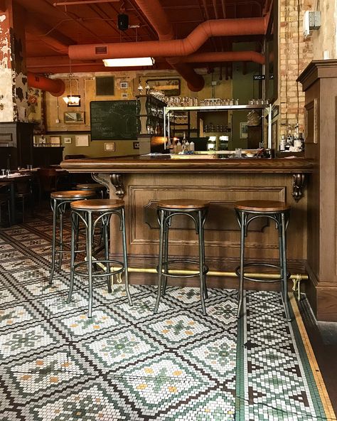 Historic hotel turned retro-chic French brasserie.🇫🇷 #frenchbrasserie #frenchdecor #restoration #tile #tiledesign #tileflooring #originalcharacter #interiordesign French Bistro Bar Design, French Cafe Flooring, French Bistro Tile Floor, French Wine Bar Interior Design, Old Fashioned Bar Design, Old Fashion Bar Design, French Brasserie Interior, Bistro Tile, Paris Cafe Interior