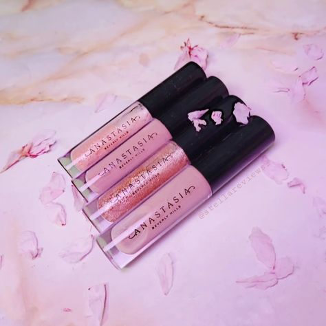 Four Anastasia Beverly Hills glosses in a row, behind a pink marble background and surrounded by pink flower petals Anastasia Beverly Hills Lipgloss, Anastasia Lipgloss, Anastasia Beverly Hills, Aesthetic Makeup, Beauty Care, Beverly Hills, Lip Colors, Lip Gloss, Lips