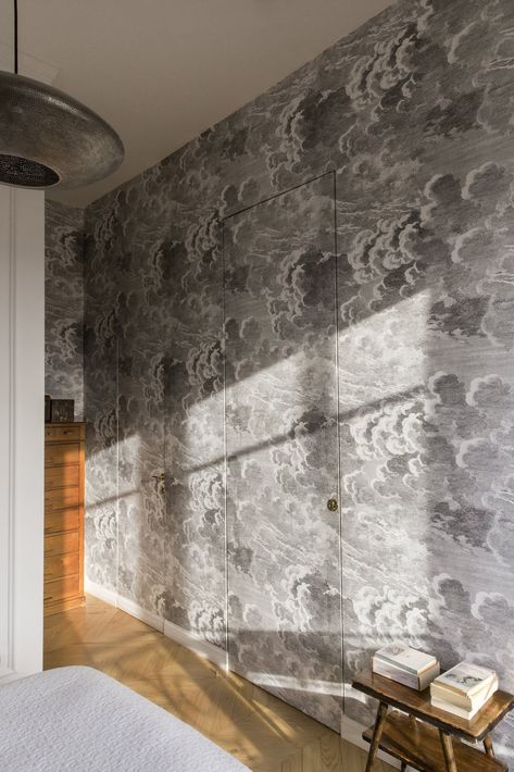 Photo 10 of 12 in A Historic Apartment in Rome Is Treated to a Dramatic New Look - Dwell Cloud Wallpaper Bedroom, Wallpaper Interiors, Fornasetti Wallpaper, Historic Apartment, Hidden Doors, Light Hardwood, Light Hardwood Floors, Bedroom Pendant, Inside Decor