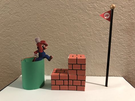 Mario Bros Valentine’s box.  Toilet paper roll, popsicle stick, hot glue, printer and scissors. Easy! Mario Blocks Diy, Minecraft Toilet Paper Roll, Mario Toilet Paper Roll, Paper Mache Mario Bros, Cardboard Box Mario Kart, Fiesta Float, Mario Diy, Mario Crafts, Card Board