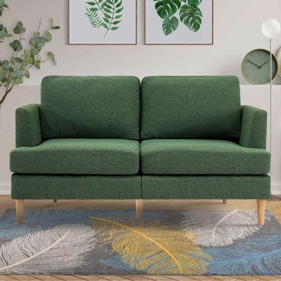 If you are looking for a centerpiece decoration for your room, you can't miss out on our modern loveseat sofa. The fabric loveseat is comfortable, affordable, and stylish without compromising on design. Our comfy loveseat has a minimalist and contemporary style that adds an elegant touch to any space. Upholstery Color: Green, Size: 32" H x 56.5" W x 35.1" D | Ebern Designs Loey Square Arm Modular Loveseat Metal in Gray | 32 H x 56.5 W x 35.1 D in | Wayfair Small Couches, Small Couch In Bedroom, Green Sofas, Mid Century Modern Couch, Couches For Living Room, Small Loveseat, Couches For Small Spaces, Small Couch, Modern Sofa Couch