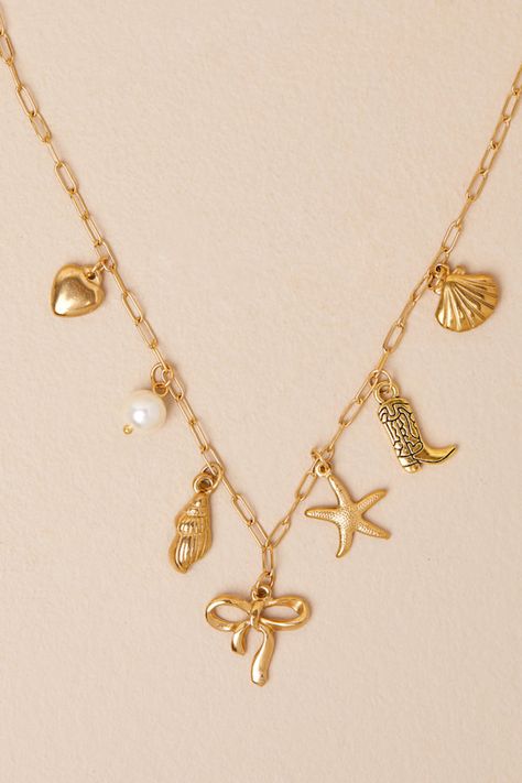 You'll make your claim as the most stylish girly around with accessories like the Petit Moments Raye Gold Chain Charm Necklace! This eclectic necklace features a paperclip-style chain that supports a variety of cute charms, which includes a heart, a faux pearl, seashells, a starfish, a cowboy boot, and a bow. Lobster clasp closure. Necklace Measures 16" Long With A 2" Extension Chain. 95% Stainless Steel, 5% Zinc. Imported. Lulus | Raye Gold Chain Charm Necklace.