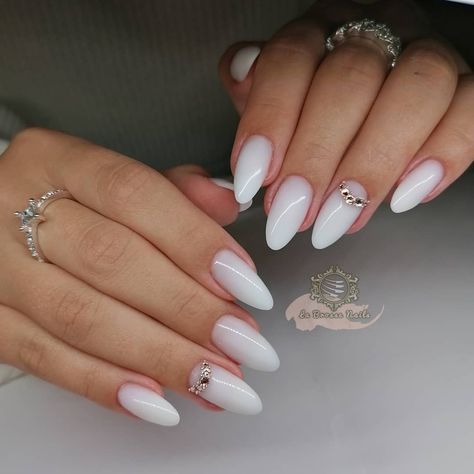 Milky white nails with Swarovski crystals. Polygel sculpted nails. Follow @labrossenails on Instagram for more Milky nails; almond nails; bridal nails; wedding nails; white nails; Bridal Milky Nails, Almond Acrylic Nails Milky White, Almond Nails Milky White, Almond Nail Milky White, Long Almond Milky Nails, White Short Nails, White Almond Nails, Almond Nail Art, Natural Nail Designs