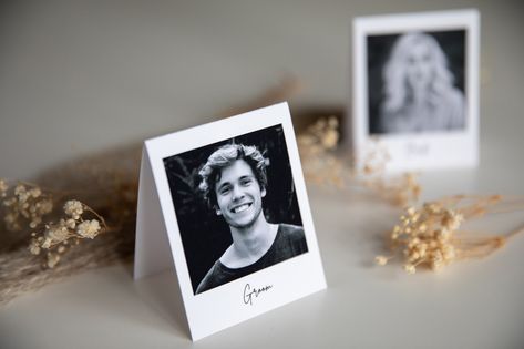 Make your wedding seating plan truly special with our fully personalized photo wedding place cards! Surprise your guests by featuring their picture on their designated seat. Each card is expertly printed on high-quality 300 gsm white paper, ensuring a beautiful presentation for your special day. Choose from a variety of styles to match your wedding theme ⭕️Traditional Polaroid style with white frame around ⭕️Color frame Cards are creased and folded to a convenient 7 cm x 9 cm size, perfect for displaying on tables or incorporating into your overall wedding decor. Available for additional charge: We can add a personalized message inside each card for an extra touch of charm We can create special design to match your wedding/party theme HOW TO ORDER🤑 1.Purchase Cards: Select the quantity of Photo Place Cards Wedding, Photo Place Cards, Nye Dinner, Wedding Table Name Cards, Wedding Seating Cards, Picture Table, Wedding Seating Plan, Wedding Table Names, Purchase Card