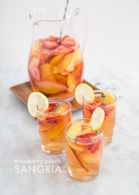 Strawberry Peach Sangria Strawberry Peach Sangria, Peaches And Strawberries, Fruit Sangria, Sliced Peaches, Yummy Summer Drinks, White Wine Sangria, Wine Sangria, Peach Sangria, White Sangria