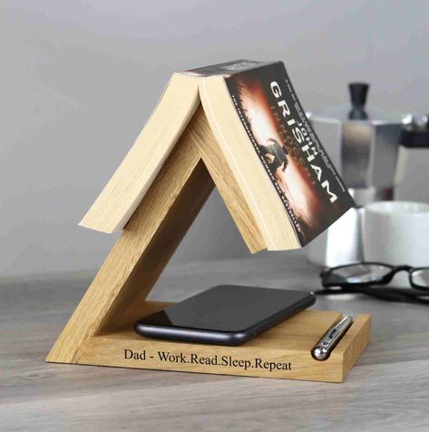 Celebrate Father's Day with a personalised solid oak bookstand, the perfect gift for bookworms! 📚 Our bedside bookrest and bookmark combo is a dream come true for any book lover. Engraved with your thoughtful or funny message, it’s a gift that’s as unique as he is. ✨ Wooden Anniversary Gift, Book Rest, Wooden Book Stand, Personalized Desk, Book Stand, Reading Gifts, Wooden Books, Diy Holz, Book Holders