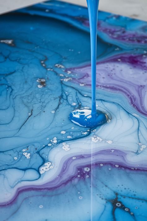 Blue and purple paint flowing and mixing on a marbled canvas. Resin Art For Beginners, Ocean Wave Art, Resin Waves, Ocean Waves Art, Acrylic Pouring Techniques, Using Resin, Art For Beginners, Art Skills, How To Craft