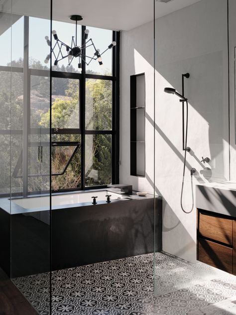 The master bathroom features cement Cigar Shop tiles by Clé Tile. The tub is made of black-honed absolute granite with plumbing ﬁxtures by Dornbracht. The lighting is the Double Octopus by Autoban for De La Espada. San Francisco Houses, Cle Tile, House Extension Design, Craftsman Style Homes, Street House, Craftsman Bungalows, Level Homes, Cheap Decor, Back To Nature