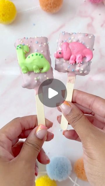 Bakery Bling™ on Instagram: "Pastel Pre-Historic Brownie Pops 🌋🦖☄️✨  Don’t let your cretaceous cake-pop dreams go extinct! @bakedbyprecious cracked the code on how to make the quickest (and dreamiest) dinosaur-themed dessert that even a beginner can master!   Just bake your favorite brownie recipe, let cool, place on a stick, dip in chocolate and cover with your choice of sprinkles + our Dinosaur Glittery Decorating Kit with 100% edible dinosaur icing accessories.   Simple, stylish & sure to be a hit with any dinosaur-lover in your life! Perfect for after school snacks or special lunch box treats! 🩵🦕  #dinosaurbrownies #dinosaurparty #dinosaurbirthday #dinosaurcakepops #cakepops #browniepops #brownies #browniecake #brownie" Dinosaur Treats, Lunch Box Treats, Dinosaur Cake Pops, Brownie Pops, Dinosaur Cupcakes, Dino Cake, Lunchbox Treats, Accessories Simple, Themed Desserts