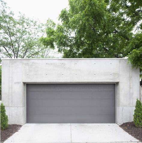 Garage and Detached Garage Room Type The darker gray garage door offers a chromatic and textural contrast to the concrete shell.  My Photos from Modern Urban Retreat in South Minneapolis Dark Grey Garage Door, Gray Garage Door, Grey Garage Doors, Gray Garage, Concrete Sheds, Grey Garage, Detached Garage Designs, Concrete Homes, Sliding Garage Doors