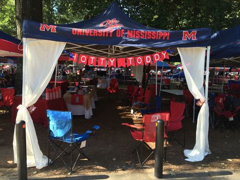 Simple curtains with a pretty bow can really take your tent up a notch Ole Miss Grove Tent, Cheer Tent Decorations, Tailgate Tent Ideas, Tailgating Tent Decorating Ideas, Tailgate Tent Decorating Ideas, Tent Decorating Ideas, Baseball Tailgate, Ole Miss Tailgating, Tailgate Decor