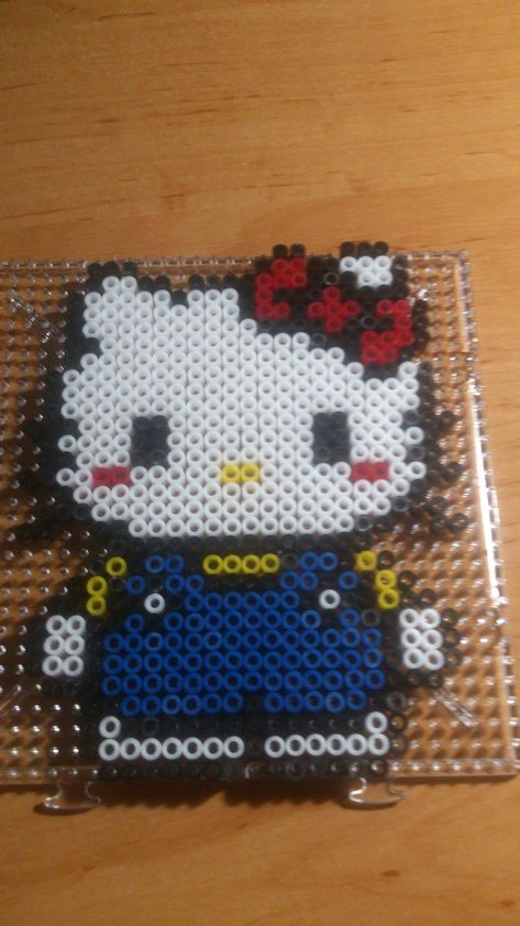 Perler Beads Hello Kitty Patterns, Pearl Beads Pattern Hello Kitty, Hello Kitty Perler Pattern, Hello Kitty Bead Art, Hello Kitty Iron Beads, Pearler Bead Patterns Sanrio, Perler Beads Ideas Sanrio, Hello Kitty Pearl Beads, Sanrio Perler Beads Pattern