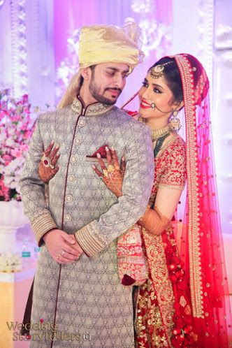 Wedding Storytellers "Portfolio" album - Candid Couple Shot - Bride in a Red Sequinned Lehenga and Groom in a Grey with Ornaments Suit. WeddingNet #weddingnet #indianwedding #indianbride #bride #bridal #sequinned #lehenga #bridallehenga #weddinglehenga #suit #green #gold #red Wedding Couple Pose, शादी की तस्वीरें, Indian Bride Photography, Bride Groom Poses, Indian Bride Poses, Indian Bride Photography Poses, Indian Wedding Poses, Indian Wedding Bride, Bride Photos Poses