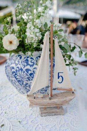 Sailboat Table Numbers, Boat Theme Wedding, Sailboat Wedding Decor, Italian Coastal Wedding, Nautical Centerpiece Ideas, Coastal Grandma Wedding, Boat Wedding Ideas, Sailing Wedding, Seaside Wedding Decor