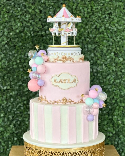 Cakes By Mena | Carousel Cake 🎠 💫 . . . #gravitycake #carousel #carouselcake #festivalcake #fondantcakes #spherecake #dfwcakes #dfwbakery | Instagram Merry Go Round Birthday Party, Pastel Carousel Birthday Party, Pink Circus Cake, Carousel Party Theme, Carousel Birthday Party Decorations, Carousel Theme Birthday Party, Carousel Baby Shower Theme, Pastel Carnival Theme Party, Carrousel Cake