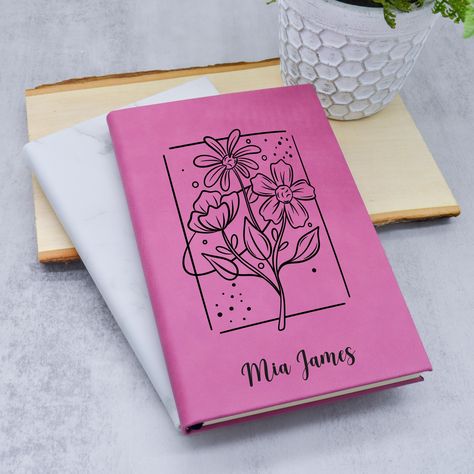 Personalized Journal for Women, Custom Leatherette Journal with Name,  Women Journal, Notebook Journal, Custom Journal, Custom Name Journal Capture your thoughts, dreams, and plans in this beautifully designed Wildflower Personalized Journal. Featuring a delicate floral design and your custom name on the cover, this notebook is perfect for journaling, note-taking, or gift-giving. Product Features: ✔️ Personalized Cover - Add any name or word to make it uniquely yours. ✔️ Elegant Wildflower Design - Soft, delicate florals for a timeless look. ✔️ Premium Quality - Durable cover with high-quality pages for smooth writing. ✔️ Perfect Gift Idea - Great for birthdays, graduations, teachers, or self-care moments. How to Order: 1️⃣ Choose the journal color from the available options. 2️⃣ Enter the