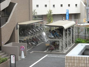 Bike parking facility Bike Parking Garage, Bike Storage Architecture, Communal Bike Storage, Bike Parking Design, Bicycle Parking Architecture, Bike Parking Lot, Bike Shelter, Sustainable Transport, Pocket Park