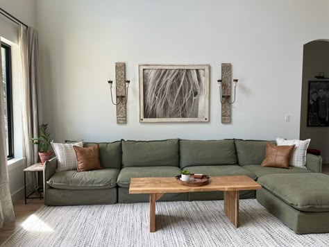 Green Couch Grey Floor, Green Couch Gray Floor, Dark Green Sectional Living Room, Greenhouse Apothecary, Grey Green Couch, Sage Green Walls Brown Leather Sofa, Sage Couch Living Room, Sage Green Sofa Living Room Ideas, Green Linen Couch