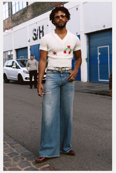 Copenhagen fashion week attendee wears a white crochet polo and flare jeans Men Flair Jeans, Flare Denim Outfit Men, Flare Pants Men Street Styles, Men’s Flare Jeans, Men Flare Jeans Outfit, Summer 70s Outfits Men, Flare Pants Men Outfit, Mens Flared Jeans Outfit, Flared Pants Outfit Men