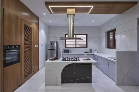 50 Noteworthy Kitchen Island Design Ideas Taking Over Indian Homes - The Architects Diary Kitchen Ideas Indian, Black Glass Dining Table, Kitchen Island Design Ideas, Indian Kitchen Design, Island Design Ideas, 3 Storey House, 3 Storey House Design, Freestanding Cabinet, Kitchen Interior Ideas