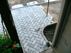 White Herringbone Pavers.  Via Doityourself.com. Herringbone Pavers, Small Outdoor Patios, Patio Pavers Design, Concrete Patios, Paver Walkway, Outdoor Patio Ideas, White Herringbone, Front Patio, Dry Creek