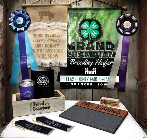 Vinyl and duck canvas banners with rosette ribbon awards, flat ribbon awards and other alternative livestock awards. Banner Display Ideas, Livestock Awards Ideas, Livestock Show Stall Signs, Buyers Gifts 4-h, Livestock Show Prizes, Livestock Show Awards, Livestock Auction, Rosette Ribbon, Livestock Barn