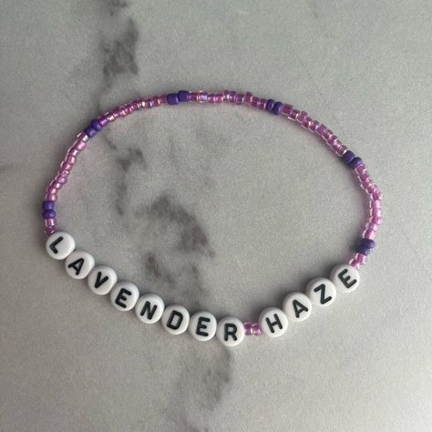 Taylor Swift Eras Tour Themed Friendship Bracelet. Made From Glass And Plastic Beads And Stretchy Elastic Band. Fits Most Teen And Small Adult Wrists. Great For Gifting Or Trading! Purple And Pink Beads With “Lavender Haze” Lyrics Spelled Out. Bundle For Best Deal. Custom Orders Available Upon Request. Taylor Swift Friendship Bracelet Eras Tour You’re On Your Own Kid (Yoyok) Trading Gift Swiftie Fan Swiftie Fan Lavender Haze Lyrics, Concert Bracelets, Taylor Swift Friendship Bracelet, Lavender Haze, Taylor Swift Eras Tour, Taylor Swift Eras, Band Fits, Taylor Swift Concert, Clay Bead