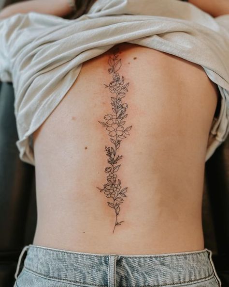 vibe tattoo utah on Instagram: "this floral spine piece is going to be so cute for summer 🤩🌷 appointment type: medium-large (depending on detail) • • • #utahtattooartist #finelinetattooartist #finelinetattoos #womenstattoos #trendytattoos #tiktok #tattok #tattooideas #tattooinspo #utahtattoostudio #vibetattooutah #microinfluencer #minimalistictattoo #contentcreator #instagramgrowth #tattooinfluencer #explore #explorepage #tattoogoals #summertattoos #spinetattoo #daintytattoos"