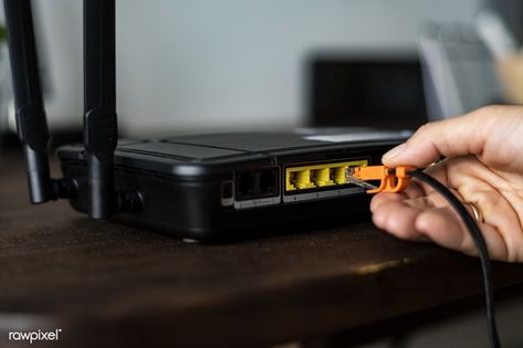 Man plugging in an ethernet cable to a wireless router | free image by rawpixel.com / Teddy Rawpixel Router Wifi, Modem Router, Wireless Routers, Wifi Signal, Fast Internet, Internet Service Provider, Wireless Internet, Wireless Router, Internet Speed