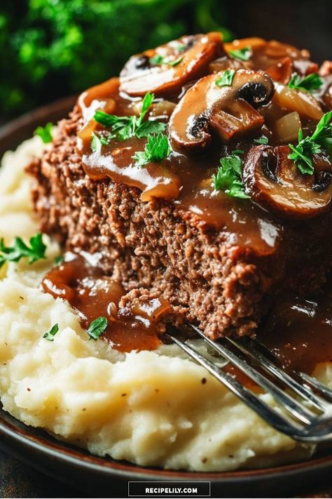 I love how this savory meatloaf, topped with a rich mushroom gravy, pairs perfectly with creamy mashed potatoes. This comfort food classic is not only easy to make but also brings back memories of family dinners gathered around the table. You won’t want to miss this delicious recipe! Meatloaf And Mushroom Gravy, Mushroom Gravy Meatloaf, Ground Beef Mashed Potatoes Recipes, Meatloaf Recipes With Brown Gravy, Meatloaf With Mushroom Gravy, Meatloaf With Brown Gravy Recipes, Gravy Meatloaf Recipes, Meatloaf With Brown Gravy, Meatloaf With Mushrooms