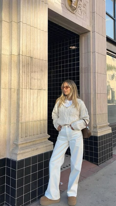 outfit details
 • cream collared cable knit sweater
 • white wide leg jeans
 • platform uggs
 • brown mini handbag
 • brown sunglasses Cream Jeans Outfit, White Jeans Outfit Winter, Uggs With Skirt, Cable Knit Sweater Outfit, Brit Harvey, Uggs Tasman, Platform Outfit, Amsterdam Outfit, Outfit With Uggs