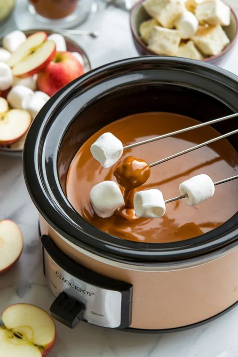 A photo of a  Crockpot Caramel Fondue a Crockpot Dessert Recipe Salted Caramel Fondue, Carmel Fondue Recipes, Caramel Fondue Recipes, Fondue In Crockpot, Diy Fondue Pot, Mini Crockpot Recipes Dip, Chocolate Fondue Recipe Crockpot, Easy Crockpot Dessert, Crockpot Fondue