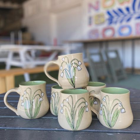 Happy first of May/Beltane/May Day! May’s birth month flowers are lily of the valley. These flowers symbolize sweetness, humility and the return of happiness. #birthflower #pottersofinstagram #ceramicstudio #instapottery #whimsicaldecor #whimsicalart #whimsicalatrist #cottagecoreasthetic May Day, Mug Art, Beltane, Whimsical Decor, Month Flowers, Ceramic Studio, Birth Month Flowers, Pottery Painting, Birth Month