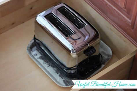 Keep a tray under your toaster to catch crumbs and make clean up easier. Toaster Tray, Where To Put Toaster On Counter, Toaster On Counter, Toaster Crumb Tray Ideas, Toaster Storage, Kitchen Counter Toaster Organization, How To Store Bread On Counter, Butter Storage, Bread Board