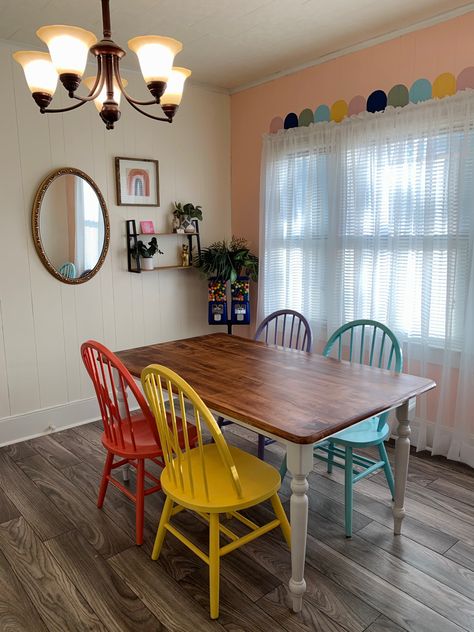 Funky Painted Dining Table, Colorful Kitchen Table And Chairs, Rainbow Dining Chairs, Colorful Cottage Dining Room, Dining Room Design Colorful, Colorful Table And Chairs, Table With Colored Chairs, Funky Dining Table, Colored Dining Table