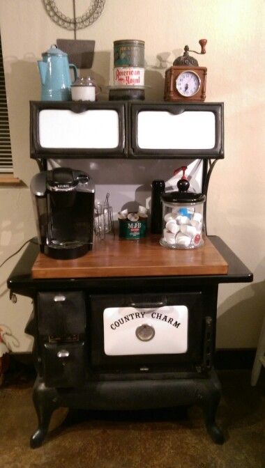 Coffee bar. Took my grandmothers old country charm electric stove, removed all the guts I could, added a left over piece of butcher block countertop to cover the burner holes and we now have a coffee bar. Antique Stove Repurposed, Antique Stove Coffee Bar, Vintage Stove Repurpose, Old Stove Repurposed, Old Sewing Machine Coffee Bar, Old Door Coffee Bar, Coffee Bar Ideas Using An Old Dresser, Coffee Bar From Antique Dresser, Kitchen Table Centerpiece Ideas