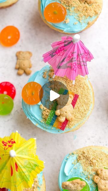 Kathryn Donangelo on Instagram: "Follow @kathryns.kitchen.blog for #EasyRecipes  SUMMER BEACH CUPCAKES☀️🏖️😎  Perfect for birthday parties, pool parties, any summer party, and kids can help assemble them! Made with your favorite cupcake flavor, ocean blue frosting, candy beach towels, crushed graham cracker sand, cute little Teddy Grahams and colorful paper umbrellas.✨  ⭐️COMMENT “recipe” and I’ll instantly send you the full recipe!  ⭐️Click the link in @kathryns.kitchen.blog bio, or search “Beach Cupcakes” on kathrynskitchenblog.com.  📌 https://kathrynskitchenblog.com/beach-cupcakes/" Pool Cupcakes, Beach Theme Cupcakes, Beach Cupcakes, Blue Frosting, Teddy Grahams, Candy Cupcake, Beach Cakes, Paper Umbrellas, Cupcake Flavors