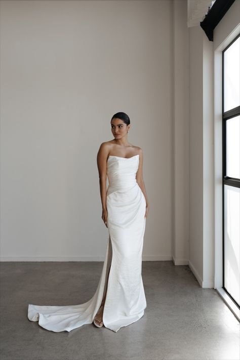 Make a statement with our Argent gown, a dress that exudes confidence and elegance. The strapless neckline offers just the right amount of coverage with subtle peaks for a touch of modernity. The pleated construction cascades like water around the corseted bodice, creating a flattering goddess silhouette that falls effortlessly over the hips. A modest side split offers a flash of leg and adds a hint of sensuality to this minimalist design. Hera Couture, Minimalist Wedding Dresses, Beaded Wedding, Satin Wedding Dress, Couture Gowns, Mermaid Fashion, Bridal Wedding Dresses, Wedding Dress Inspiration, French Lace