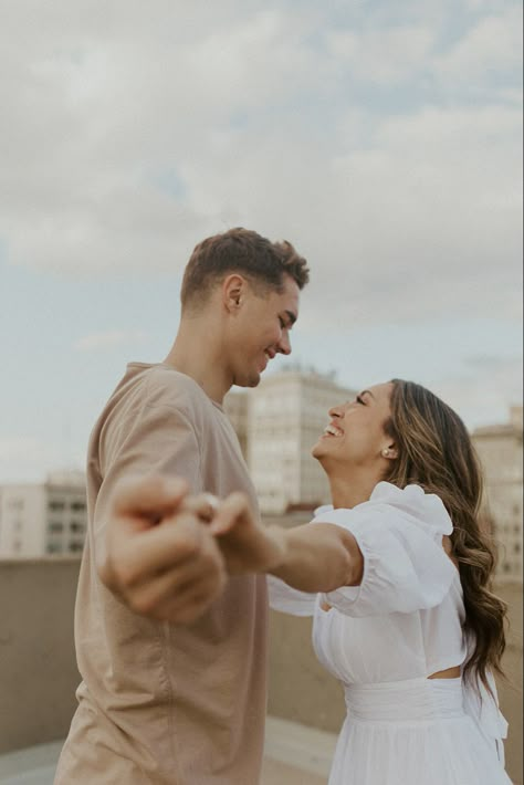 Unique Engagement Poses Couple, Rooftop Deck Photoshoot, City Vibes Engagement Pictures, Engagement Pictures Rooftop, Downtown Rooftop Engagement Photos, Couples Photoshoot Rooftop, Rooftop Couples Session, Engagement Photoshoot Rooftop, Rooftop Engagement Shoot