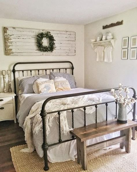 Farmhouse living has a very unique feel. If you long for that feeling, you can create a farmhouse style bedroom and have a warm and cozy space of your... | -wrought-iron-bed #bedroom #farmhouse #farmhousebedroom #farmhousedecor #farmhouseideas #decoratedlife Iron Beds, Vintage Bedroom Decor, Farmhouse Style Bedrooms, Modern Farmhouse Bedroom, Decor Ikea, Cute Dorm Rooms, Iron Bed, Vintage Bedroom, Farmhouse Bedroom Decor