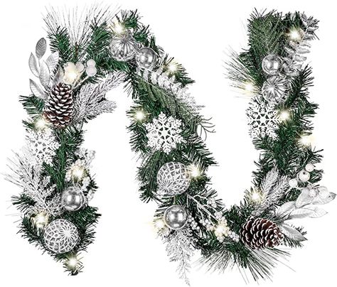 Amazon.com: Valery Madelyn Pre-Lit 6 Feet Frozen Winter Silver White Christmas Garland with Shatterproof Ball Ornaments, Snowflakes and Silver White Leaves, Battery Operated 20 LED Lights: Home & Kitchen Christmas Garland With Lights, White Christmas Garland, Garland With Lights, Xmas Garland, Christmas Garland, Battery Operated, White Christmas, Christmas, Silver