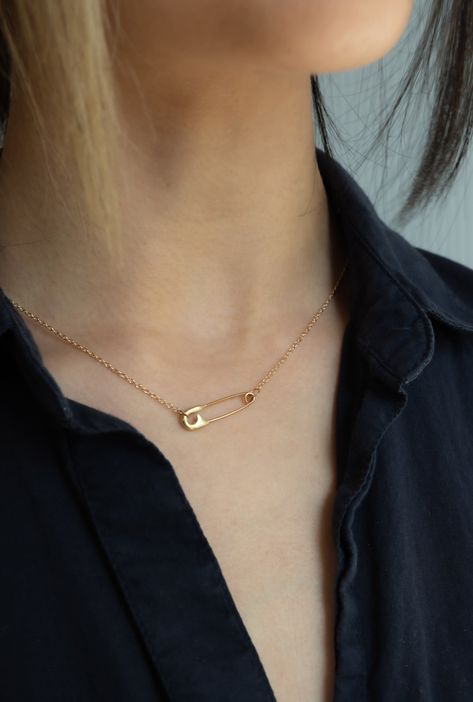 - Gold safety pin necklace - 14K reclaimed solid gold SIZE NOTES - Necklace length including the safety pin = 16 inches - Safety pin closure SUSTAINABLY MADE - From Futaba Hayashi (Brooklyn, New York) - Designed and handmade in NYC - Made from reclaimed gold - Sustainable values: #5: No waste, #7: Safe, livable, dignified employment, #9 No animal cruelty This product ships directly from Futaba Hayashi. Not available in store. Safety Pin Chain Necklace, Safety Pin Jewelry Ring, How To Make Safety Pin Necklace, How To Make A Safety Pin Necklace, Safety Pins Necklace, Safety Pin Chain, Safety Pin Accessories, Pin Necklace Diy, Safety Pin Necklace Diy