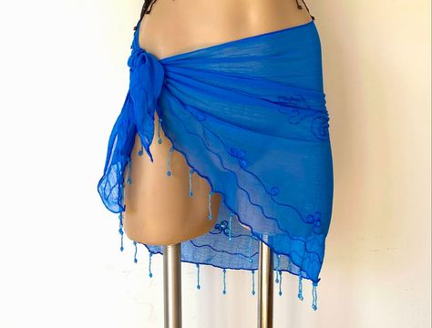 Fantastic little coverup  lives in your bag & takes you from beach to bar as a skirt, a top or both.  Beautiful handmade Resort Wear Sheer Chiffon Sarong, design embroidered & with hand sewn matching sequin accents and a gorgeous dangling completely hand beaded fringe.  When wearing a swimsuit just wont get you into the bar or restaurant, this fantastic skirt and top is a wonderful way to be dressed, look hot and still be resort casual. It's a shoulder cover when the sun goes down & the night ch Blue Beach Skirt, Pool Fits, Resort Aesthetic, Beach Coverups, Swimsuit Coverups, Resort Casual, Sarong Wrap, Sarong Skirt, Top Strapless