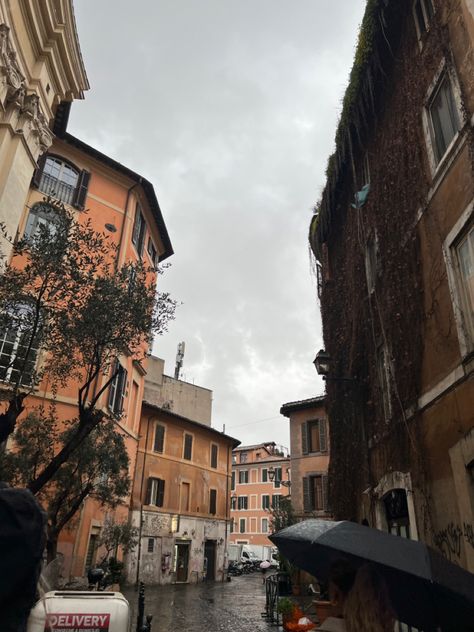 Pretty Trastevere street in Rome on a rainy day Italy Rain, Lisbon Rainy Day, Prati Neighborhood Rome, Rome In The Rain, Rome Streets, Rain Photography, Rainy Days, Rainy Day, Rome